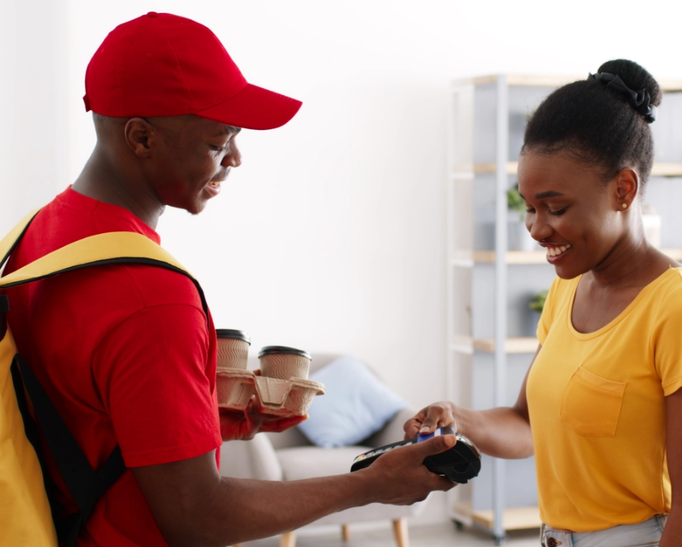 Delivery rider handing over a NowNow card